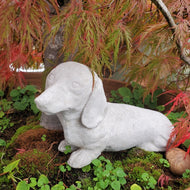 Small concrete dachshund dog statue